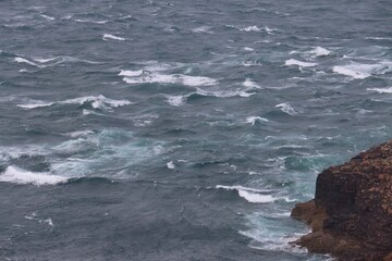 waves crashing on rocks