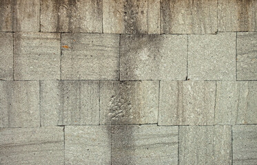 Ancient stone wall background and texture. These stone blocks were used to build temples in the Java region of Indonesia.