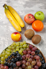top view different grapes with other fruits on light-white desk fruits fresh mellow juice summer