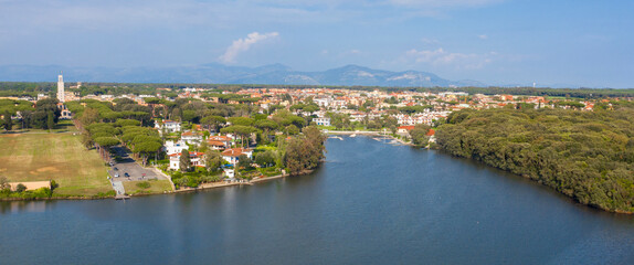 Aerial view of Sabaudia, in the province of Latina, Italy. In the foreground, Lake Paola. - obrazy, fototapety, plakaty