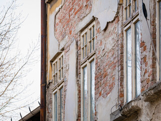 Fototapeta na wymiar Detail with an old worn out building. Old vintage architecture in Bucharest, Romania.