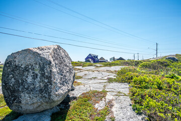 Low angle view of rocks against sky in Peggy's Cove, Nova Scotia.