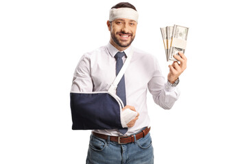 Man with an arm sling and bandage on head holding stacks of money and smiling