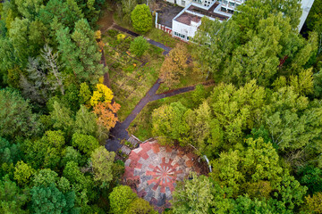 Aerial view of the territory of the old Soviet dispensary surrounded by green trees