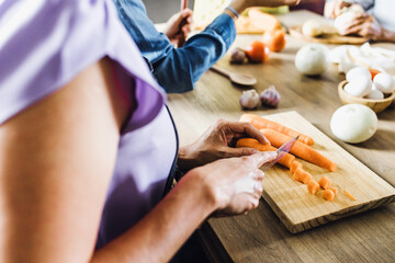 latin family of women cooking with in kitchen at home in Mexico, hispanic multi generational family...