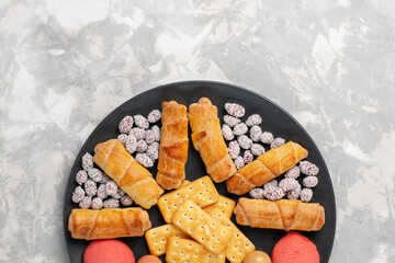 top view yummy cakes with bagels and candies on white background cake biscuit cookies sugar sweet pie