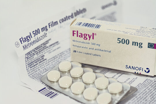 Cairo, Egypt, May 4 2023: Flagyl metronidazole 500mg tablets,  Amebicides, an antibiotic that is used to treat bacterial infections of the vagina, stomach, liver, skin, joints, brain and spinal cord