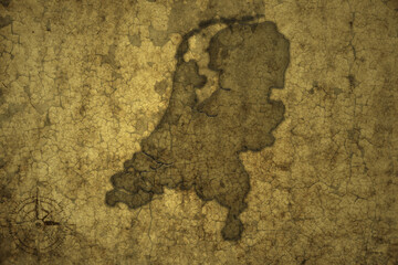 map of netherlands on a old vintage crack paper background .
