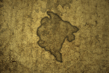 map of montenegro on a old vintage crack paper background .