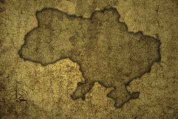 map of ukraine on a old vintage crack paper background .