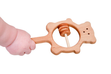 Baby hand and toy rattle abacus, close-up, isolated on a white background. Children fingers and an object on a white background