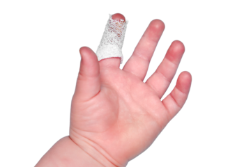 Baby s hand with a bandaged finger on a white isolated background, close-up. Injured index finger of a child wrapped in a white bandage. Kid boy aged one year and three months