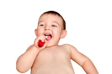 Happy toddler baby brushes his teeth with a toothbrush, isolated on a white background. A smiling child boy cleans his teeth with a brush on his own, isolated on a white background. Kid age one year