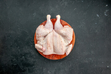 top view fresh raw chicken on dark background cooking butcher dish food meat salad barbecue color dinner