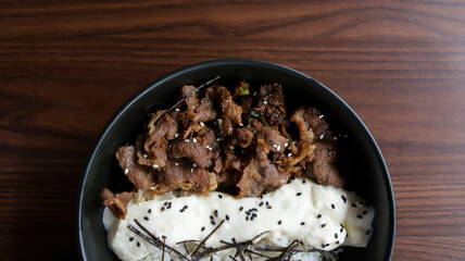 Gyu cheese don consist of Juicy beef, sautéed and served over rice with a savory, creamy cheese...