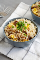 Homemade Fried Rice with Bacon and Egg in a Bowl, side view.