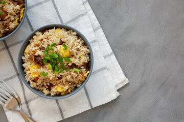 Homemade Fried Rice with Bacon and Egg in a Bowl, top view. Flat lay, overhead, from above. Space for text.