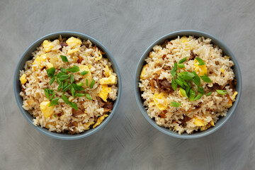 Homemade Fried Rice with Bacon and Egg in a Bowl, top view. Flat lay, overhead, from above.