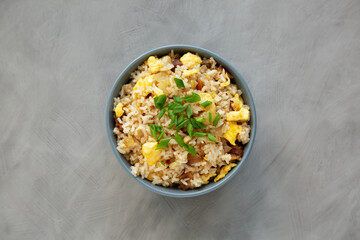 Homemade Fried Rice with Bacon and Egg in a Bowl, top view. Flat lay, overhead, from above.