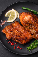 Delicious fried sea bass fish in the form of slices with spices and herbs