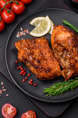 Delicious fried sea bass fish in the form of slices with spices and herbs