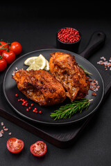 Delicious fried sea bass fish in the form of slices with spices and herbs