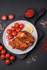 Delicious fried sea bass fish in the form of slices with spices and herbs
