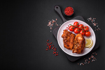 Delicious fried sea bass fish in the form of slices with spices and herbs