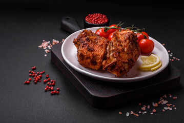 Delicious fried sea bass fish in the form of slices with spices and herbs