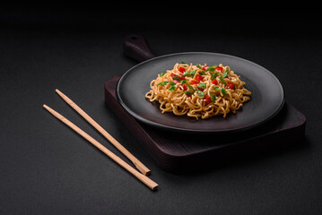 Delicious fresh Asian noodles with vegetables, salt, spices and herbs