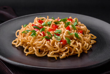 Delicious fresh Asian noodles with vegetables, salt, spices and herbs