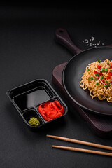 Delicious fresh Asian noodles with vegetables, salt, spices and herbs