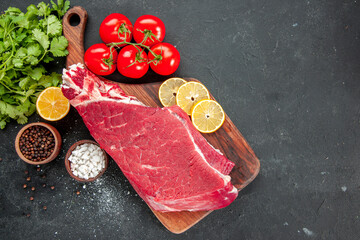 top view raw meat slice with red tomatoes and greens on dark background ripe health diet food color salad
