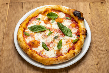 delicious italian pizza on a wooden table

