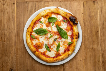delicious italian pizza on a wooden table
