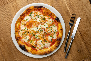 delicious italian pizza on a wooden table
