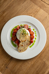 delicious buratta cheese on a white plate
