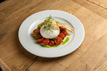 delicious buratta cheese on a white plate
