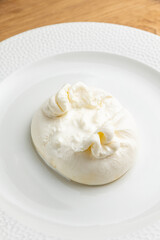 delicious buratta cheese on a white plate
