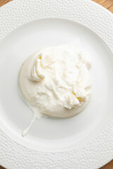 delicious buratta cheese on a white plate
