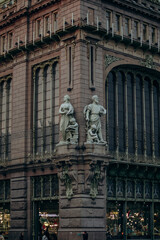 Beautiful sculptures on an old building in modern and classical style.