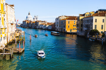 Boats on Venice canal sunny day