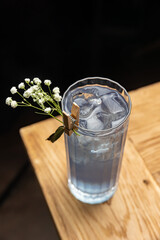 Alcoholic drinks on an old wooden table close up. 
