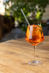 Alcoholic drinks on an old wooden table close up. 