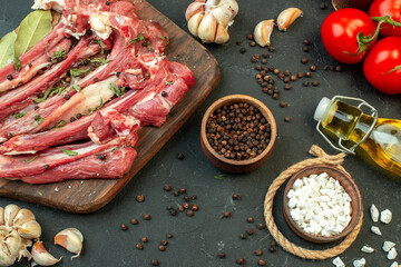 top view raw meat slice with tomatoes on dark background salad meat butcher cooking raw dish meal