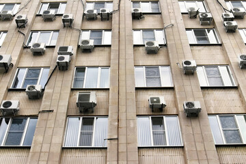 mani air conditioners on the building wall