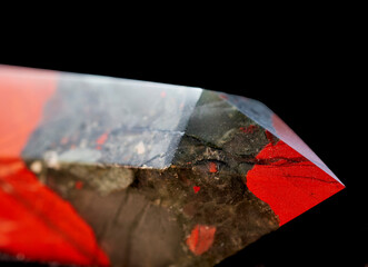 Close up of a Bloodstone Jasper mineral specimen cut into an Oblelisk