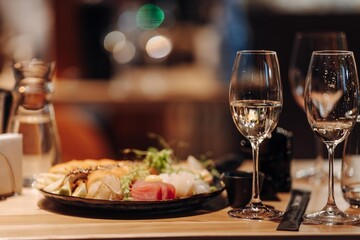 glass of dry White wine ripe grapes and bread on table in vineyard