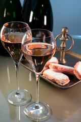 Tasting of rose brut Champagne sparkling wine in cellars of gran cru wine house in Epernay, wine tour in Champagne, France