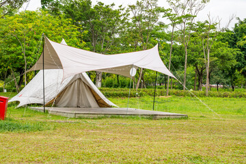 Camping tents on green grass in the park